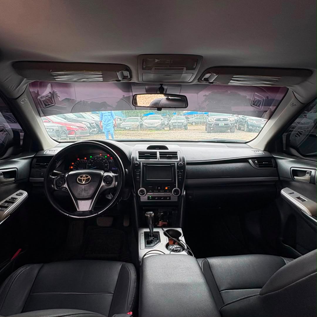 
								Neatly Used 2013 Toyota Camry SE | Abuja / Recent Duty . 2.5L 4-Cyl, 178hp, 6-Speed Auto, SE Sport package, AC Cold, 6.1″ Display, Bluetooth, Backup cam, 17″ Alloys, Cruise.  Price: 10.5m Clean, sporty and reliable midsize sedan. full									